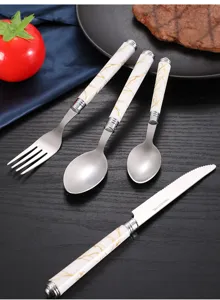 Stainless steel flatware set with marble ceramic handle, elegant kitchen cutlery for dining.