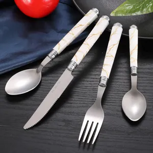 Stainless steel cutlery set with white marble ceramic handles, dinner knife spoon fork tableware.