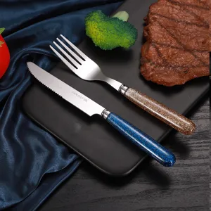 Set di coltello e forchetta da tavola in acciaio inossidabile con manici glitterati vista principale