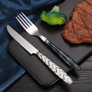 Stainless steel western tableware knife and fork set with modern geometric handles for kitchen.