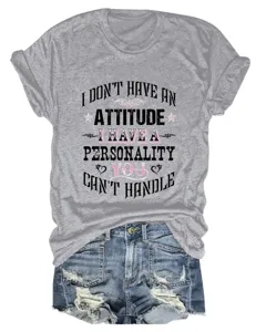 Details of women's grey short sleeve t-shirt with graphic print and denim shorts outfit.