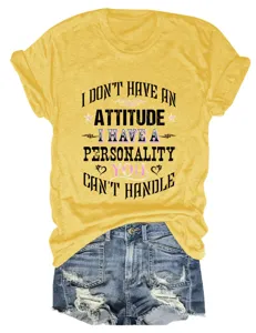 Yellow short sleeve t-shirt detail with custom slogan print, paired with distressed denim shorts.