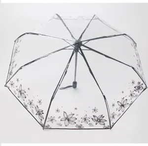 Ombrello pieghevole trasparente con elegante stampa floreale nera, protezione elegante.
