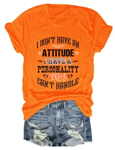 Orange slogan graphic short sleeve t-shirt paired with distressed denim shorts for women casual wear.