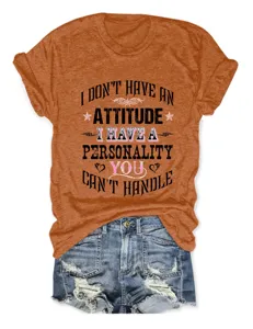 Casual women's orange short sleeve t-shirt with funny letter print and denim shorts outfit.