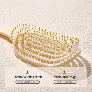 Curved hair massage comb detail view, beige vented design with rounded tips for scalp care.