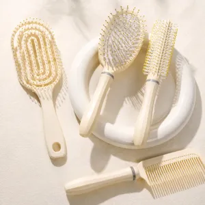 Hair brush set including cushion, vent, styling, and flat combs in beige for daily hair care.
