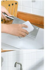 Detailed view of white nano cleaning sponge in action, scrubbing kitchen knife safely and efficiently.