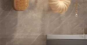 Bathroom detail scene showing luxury wall hook and hanging bath accessories on marble wall.