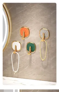 Luxury wall-mounted sticky hook for bathroom and kitchen, punch-free adhesive design.