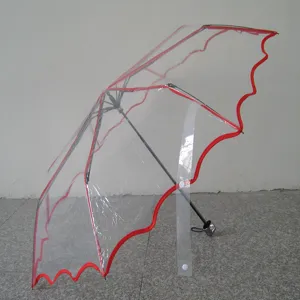 Transparent POE folding umbrella with red wavy edge detail, perfect for rainy and sunny days.
