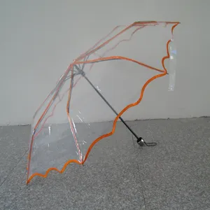 Transparent folding umbrella with orange border, waterproof POE material for rainy days.