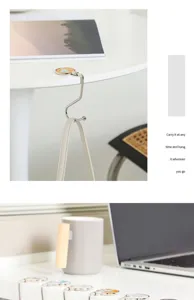Portable folding desk hook for bags, durable metal hanger for office and student use.