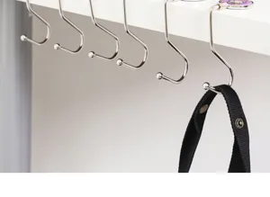 Portable desk hook for bags and backpacks, metal folding hanger for office and student use.