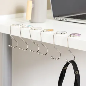 Portable desk hook for bags, foldable metal table side hanger for office and school use.
