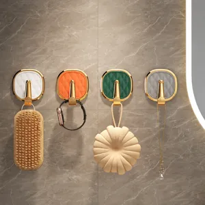 Light luxury wall hook, punch-free adhesive small hooks for bathroom and kitchen home organization.