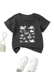 Close-up detail of dark grey toddler t-shirt featuring creative white snail pattern print.