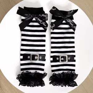Punk style black and white striped arm sleeves with lace trim, bow, and buckle details for women.