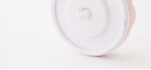 Detailed close-up view showing the bottom rotating axis of the manual garlic chopper.