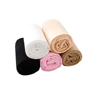 Children's dance tights, soft open-hole ballet socks rolled up in multiple vibrant colors.