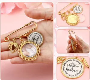 Detailed view of gold memory brooch pin, glass photo tray charm, and angel wings pendant.