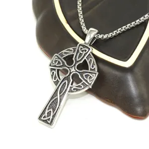 Stainless steel hollow cross pendant necklace detail view showcasing intricate Celtic knot design.