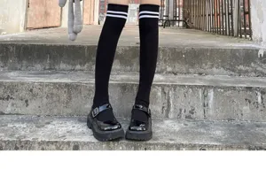 Women black knee high socks with white stripes, stylish over the knee hosiery for daily wear.
