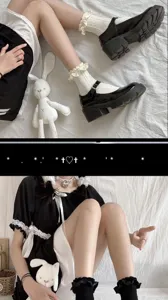 Close-up detail of sweet frilly lace short socks paired with black shoes and Lolita dress.