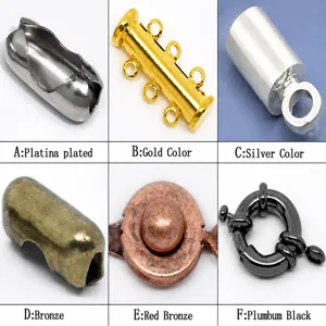 Metal jewelry findings and clasps detail showing various color platings and shapes for crafting.