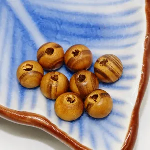 Natural striped pine wood round loose beads with center hole for DIY bracelets and crafts.