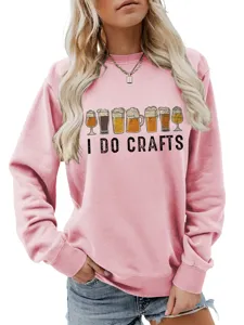 Detail view of the pink sweatshirt featuring fun beer glasses and I do crafts graphic print.