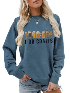 Detail view of blue women autumn sweatshirt featuring beer glasses graphic and I do crafts text.