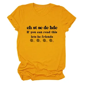Crochet lover t-shirt detail showing the funny text print and mustard yellow fabric.