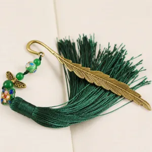 Vintage metal feather bookmark with green tassel and cloisonne beads for reading lovers.