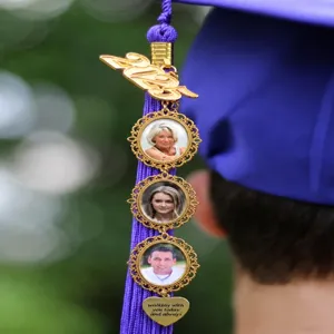 Graduation cap tassel detail showing custom photo charms and metal 2025 year pendant.
