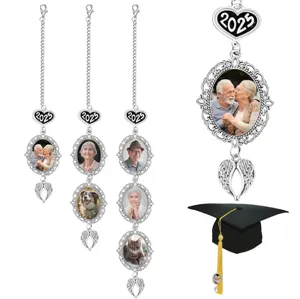 Detailed view of DIY photo frame charm with 2025 heart and angel wings for graduation cap.