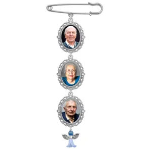 Close-up detail of the vintage silver memorial photo charm pin featuring three ornate oval frames.