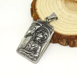 Vintage stainless steel crypto Buddha pendant detail showing intricate relief and texture design.