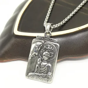 Vintage stainless steel pendant necklace for men with unique carved Buddha design detail.