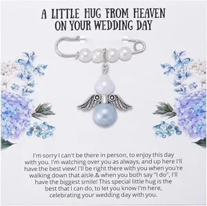 Close-up detail of wedding guardian angel pearl brooch with memorial message card display.