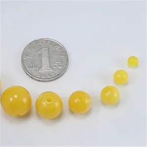 DIY yellow round loose beads for jewelry making, smooth amber imitation craft supply.