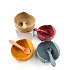 Cute silicone snail baby bowl and spoon set, durable anti-drop suction toddler tableware.