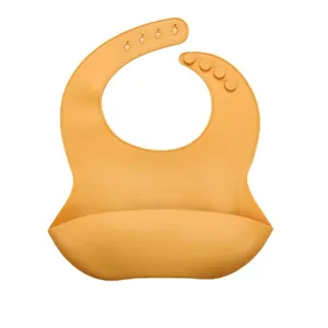 Silicone baby bib for toddler self-feeding with crumb catcher and adjustable neck straps.