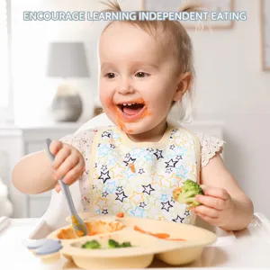 Baby silicone training spoon and partitioned suction plate set for infant self feeding.