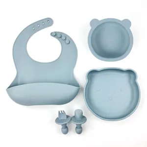 Baby silicone feeding set with bear bowl, plate, bib, fork and spoon in grey blue color.