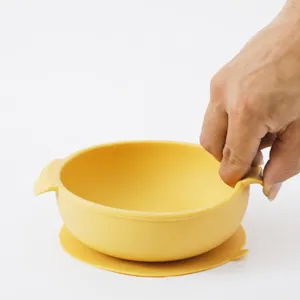 Silicone baby suction bowl with dual handles, heat resistant and anti-tip toddler feeding dish.