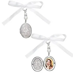 Wedding bouquet photo charm with white ribbon pearl pendant, oval locket in dual view display.
