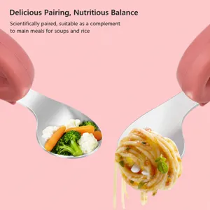 Detail view of baby silicone short-handle stainless steel fork and spoon holding healthy food.