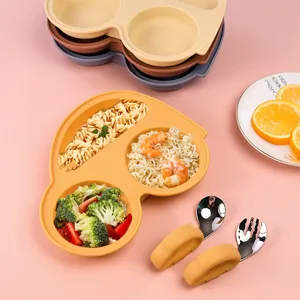 Silicone car-shaped divided plate for kids detail view, featuring food compartments and spoon set.