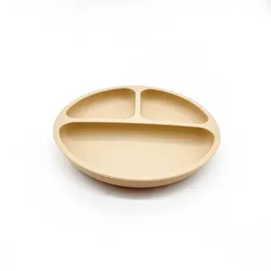 Silicone baby suction plate with three divided compartments for toddler feeding and food storage.